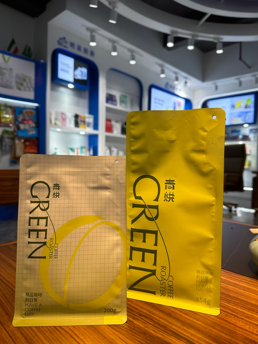 Qinghong Coffee branded green coffee pouches in 200 g and 454 g sizes