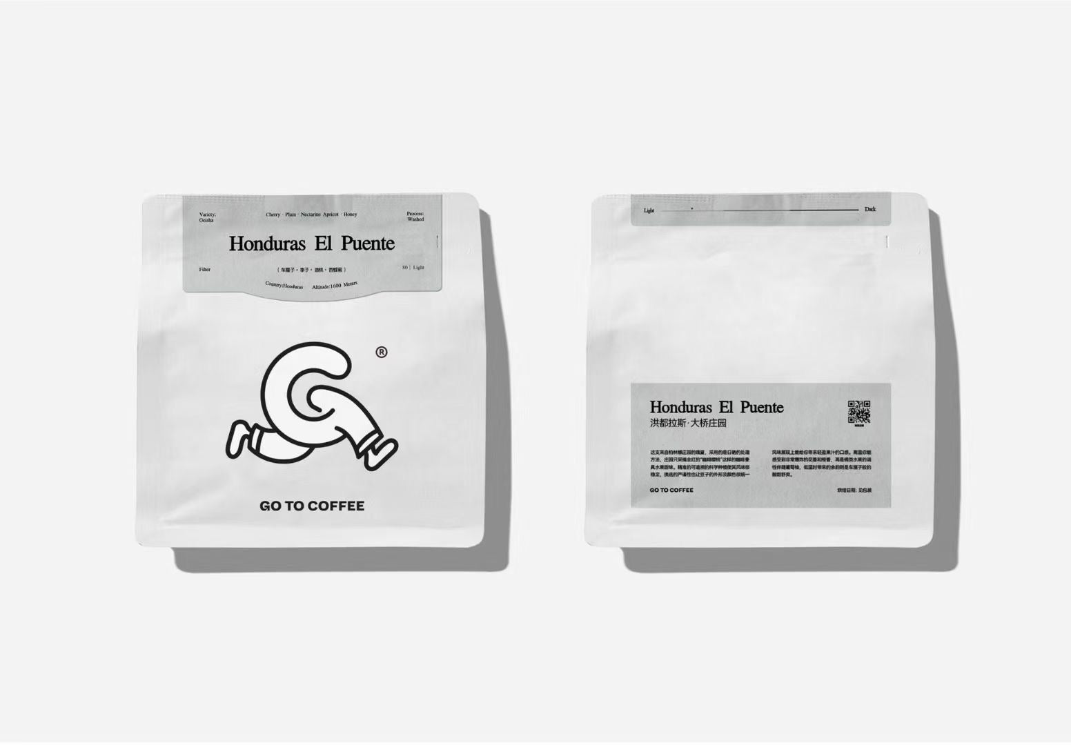 Real white coffee pouches shown front and back with black typography and illustrated artwork